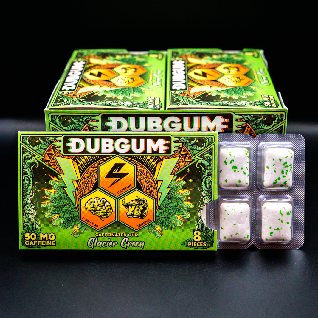 Two green boxes of Dubgum Glacier green 50 mg caffeine, with two blister packs of white capsules containing green specks, displayed on a black background.